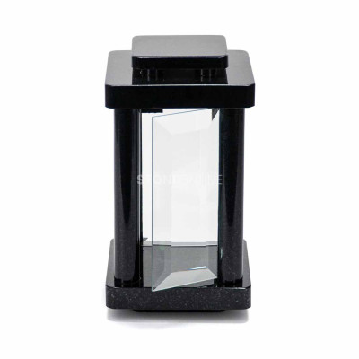 Granite lantern for a grave – rounded edges and elegance.