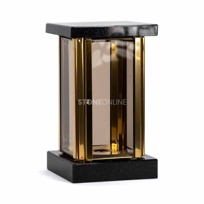 Square lantern for a candle and a geometric flower vase make a cohesive grave set.