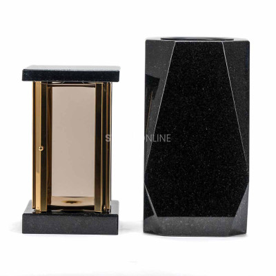 Geometric lantern and vase for a monument – durable blend of gold details and natural granite.
