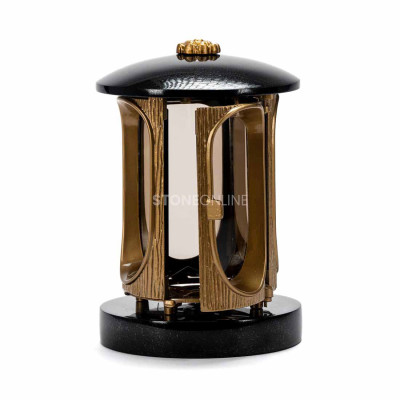 Decorative lantern and light-looking vase create a harmonious remembrance arrangement.