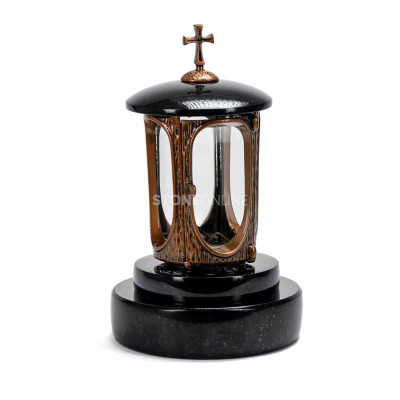 Copper lantern LALUMCROSSCOPPER with cross on a sturdy round granite base.