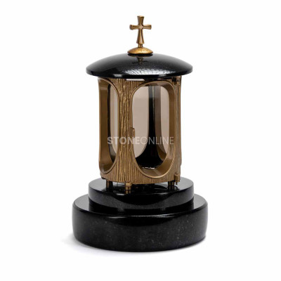 LALUMCROSSGOLD gold lantern with ornate cross on the PROUND granite base.