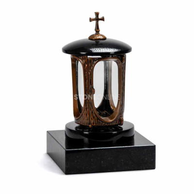 Copper lantern LALUMCROSSCOPPER with cross on a square polished granite base.
