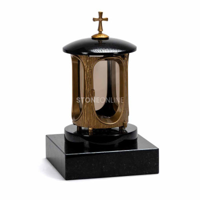 LALUMCROSSGOLD gold lantern with cross on a heavy square granite base.
